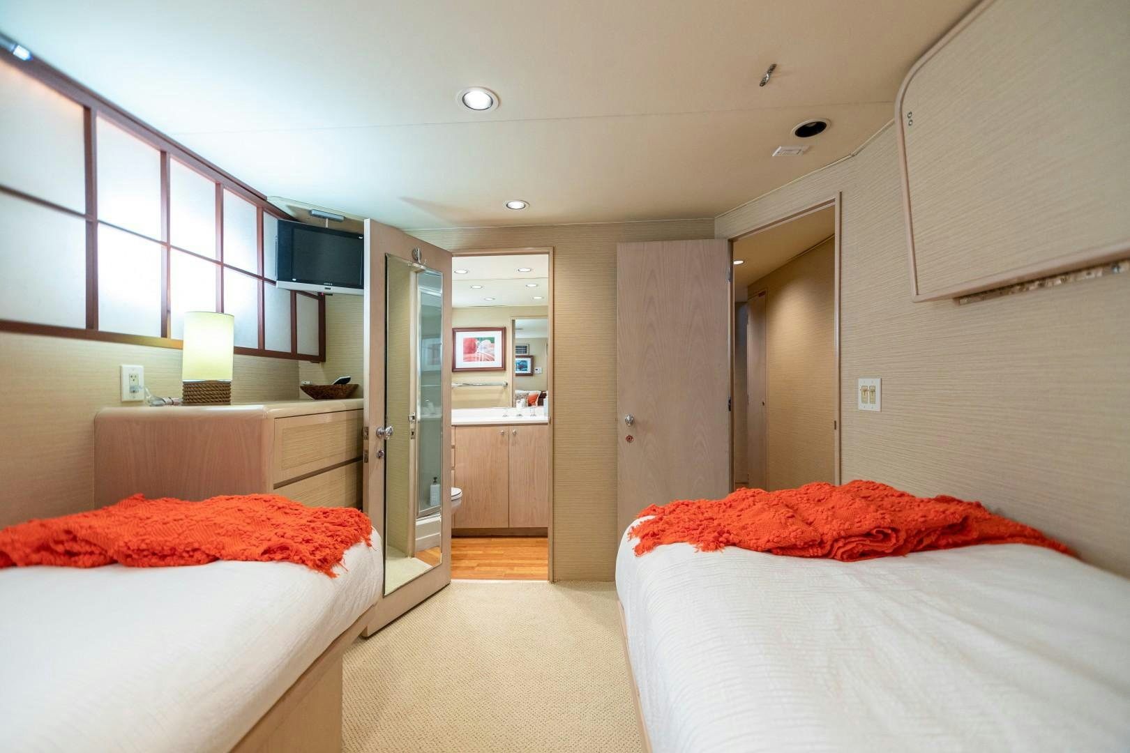 a bedroom with two beds aboard ISLAND TIME Yacht for Sale