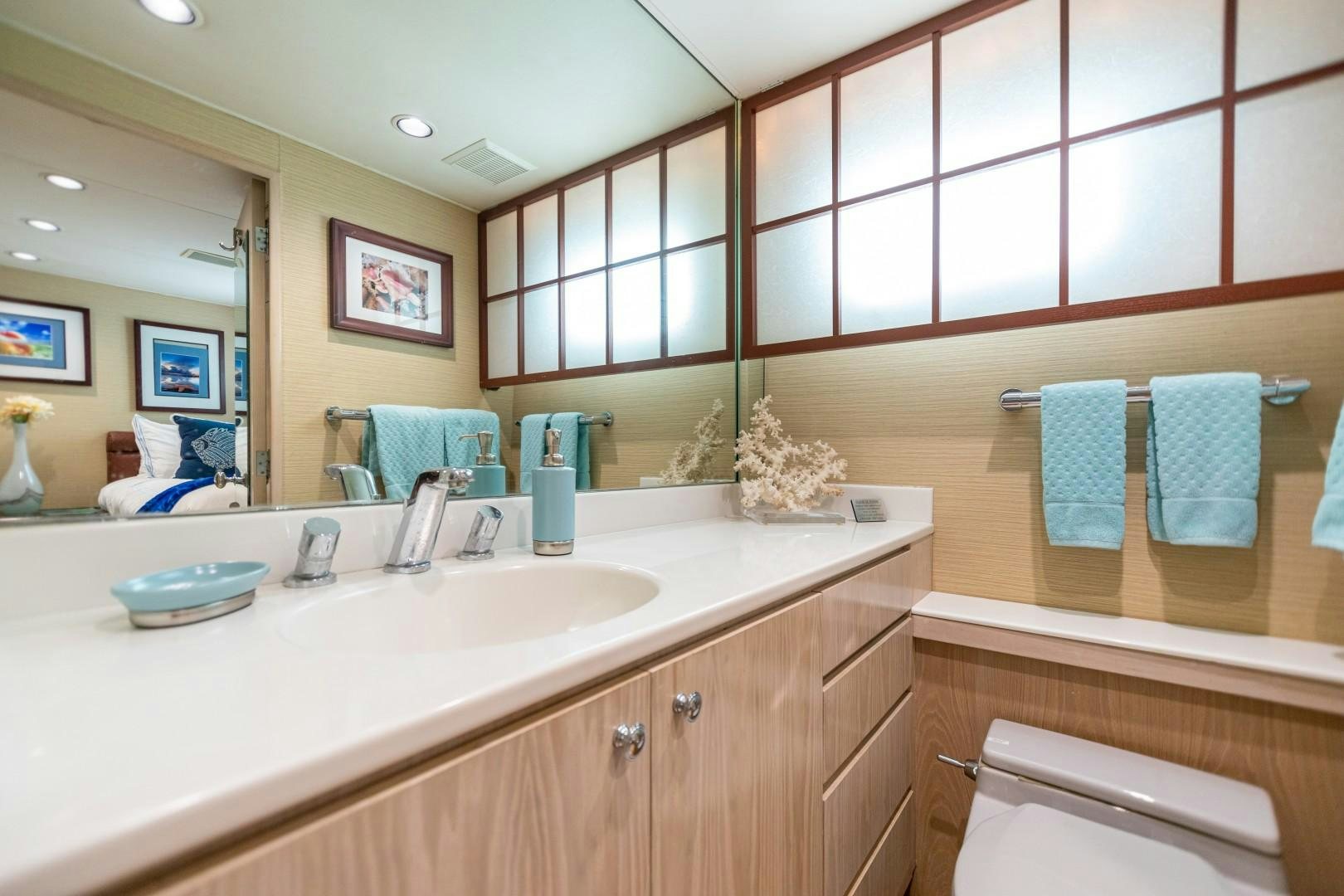 a bathroom with a large mirror aboard ISLAND TIME Yacht for Sale