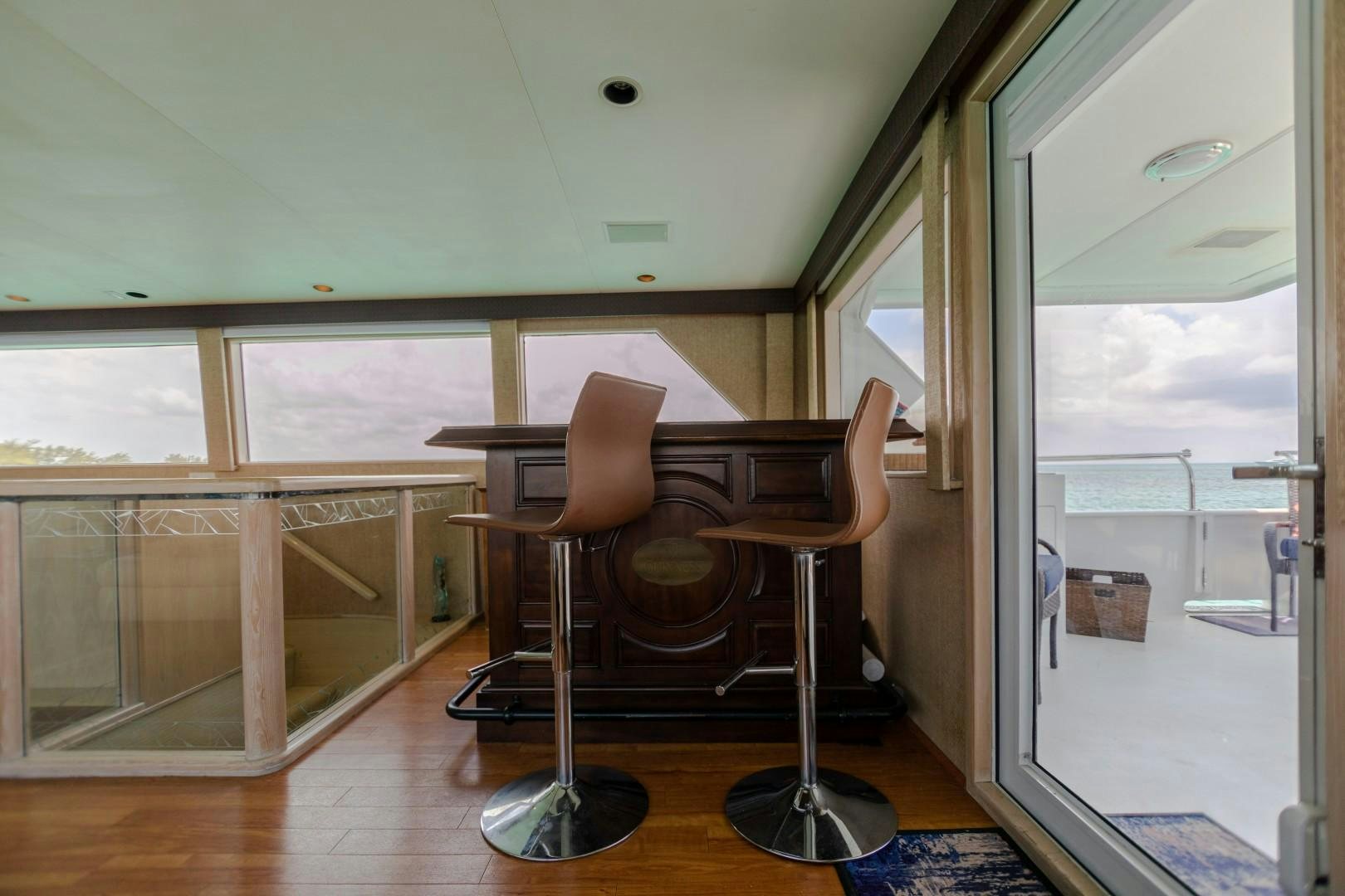 a room with a table and chairs aboard ISLAND TIME Yacht for Sale