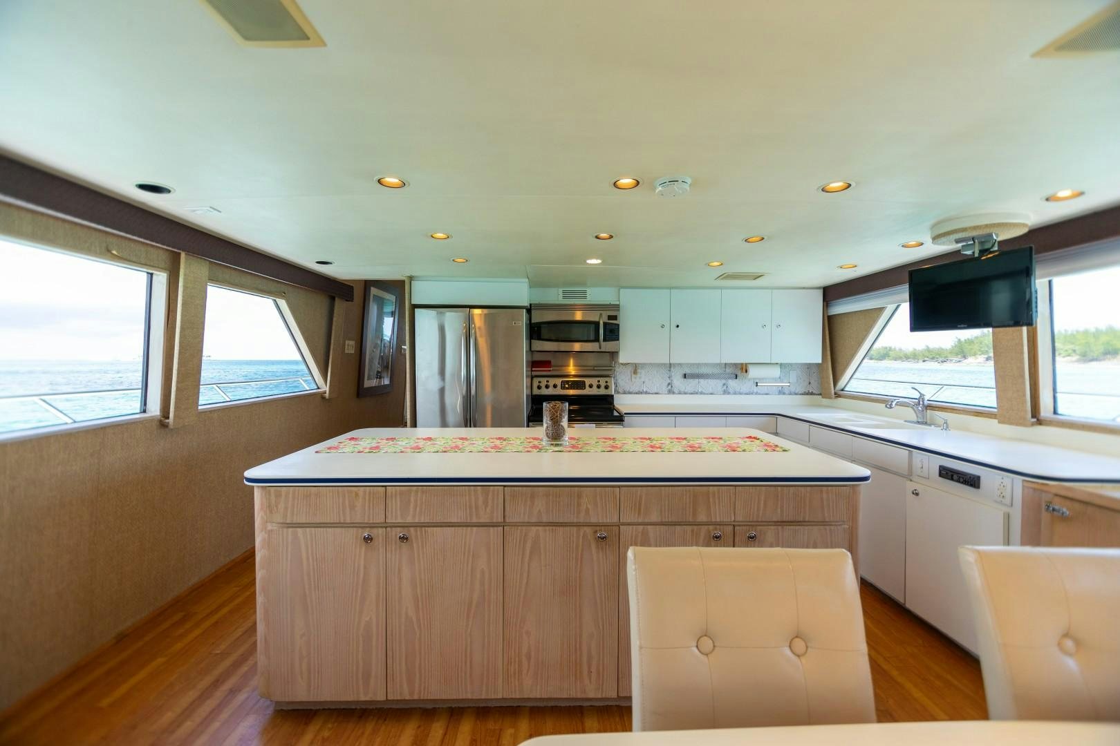 a kitchen with a large island aboard ISLAND TIME Yacht for Sale