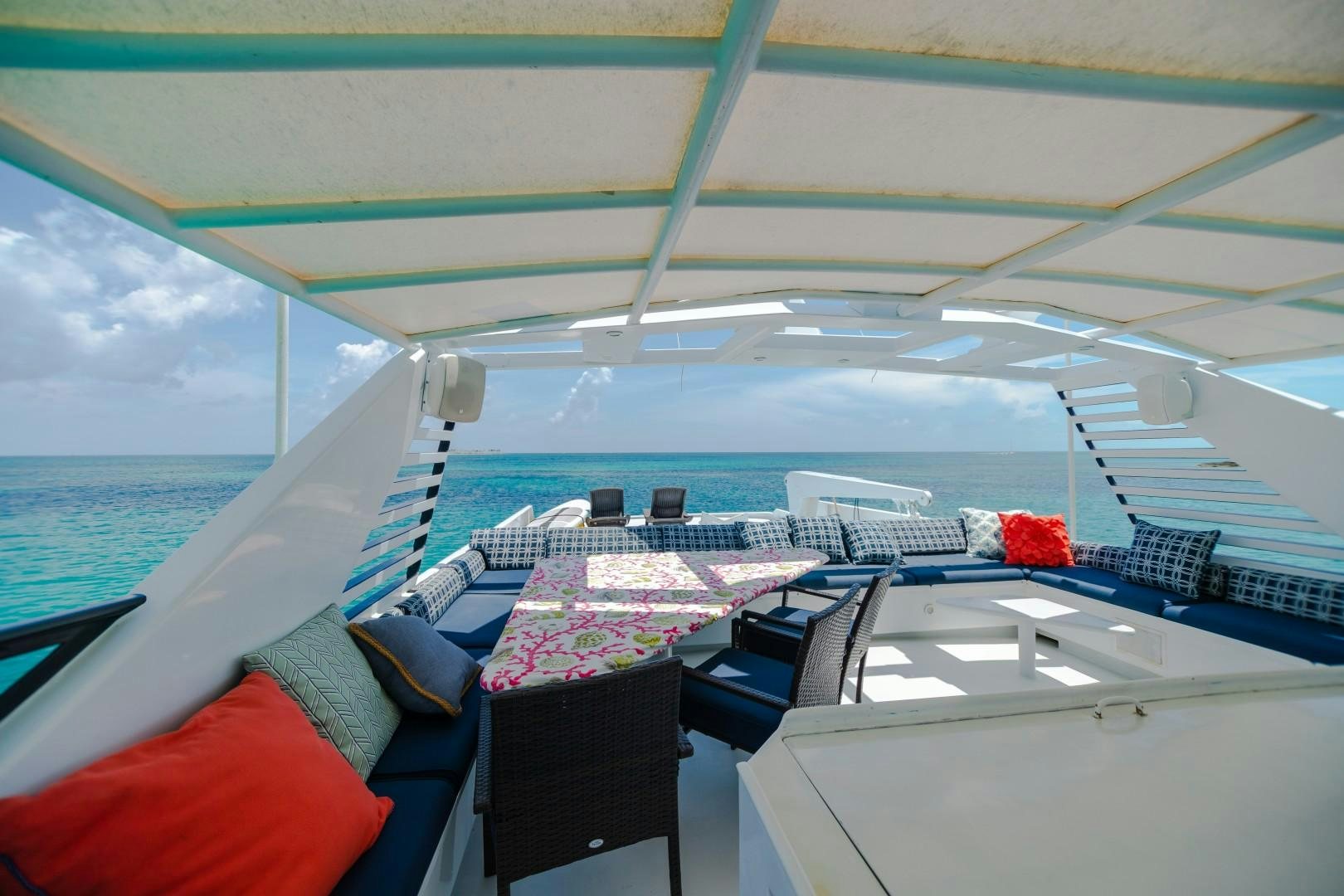 a boat with a table and chairs on it aboard ISLAND TIME Yacht for Sale