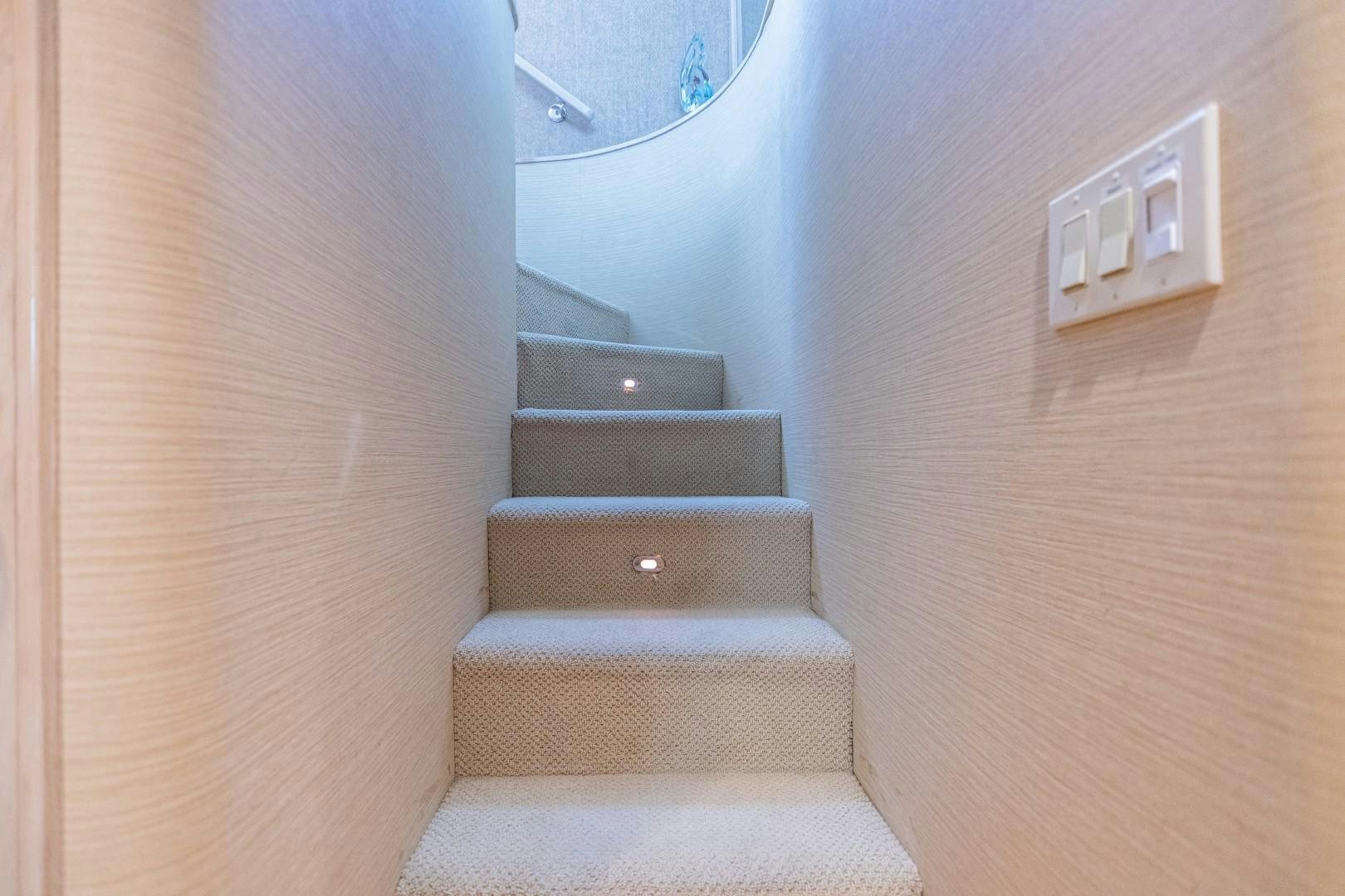 a staircase with a carpet aboard ISLAND TIME Yacht for Sale