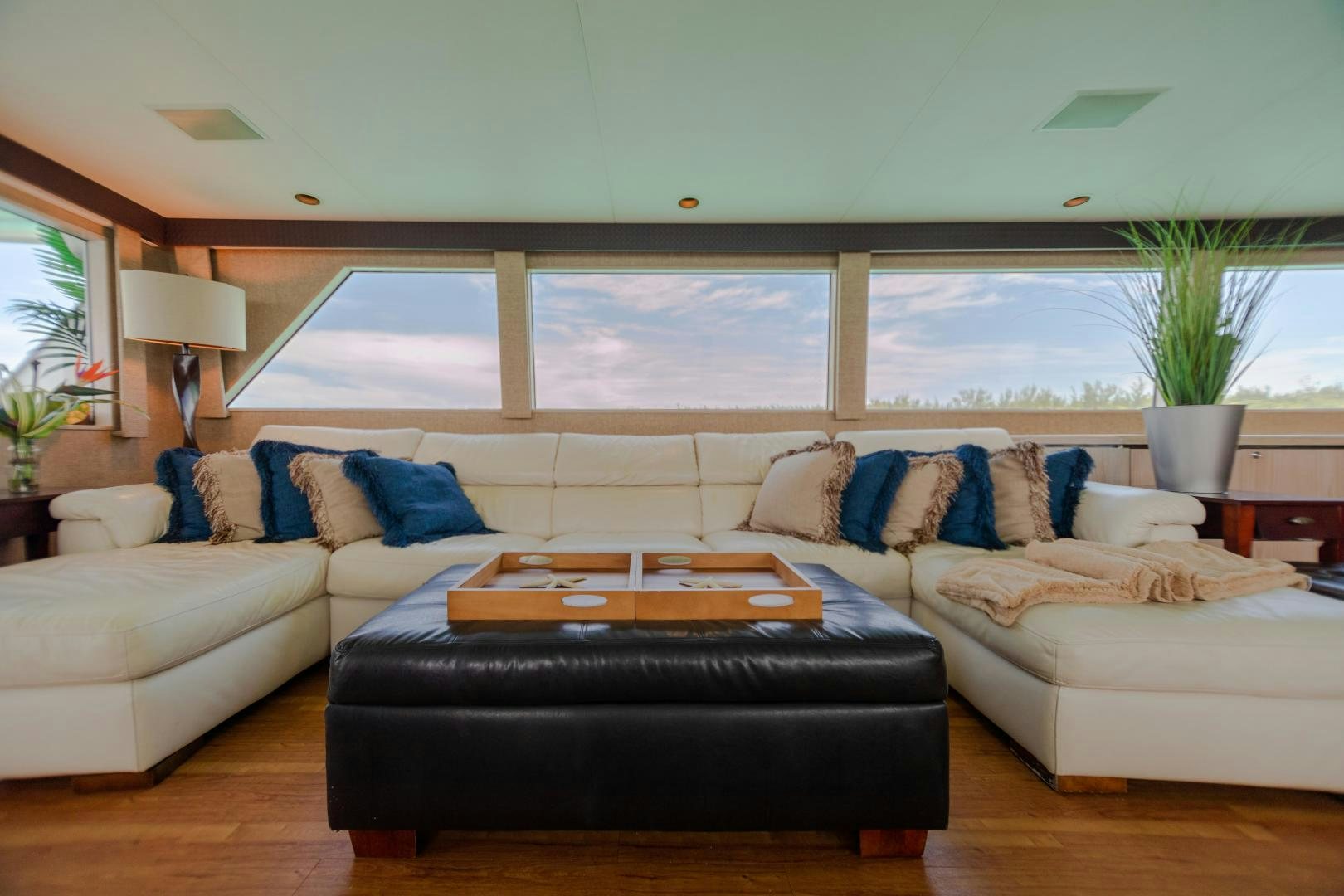 a living room with a large window aboard ISLAND TIME Yacht for Sale
