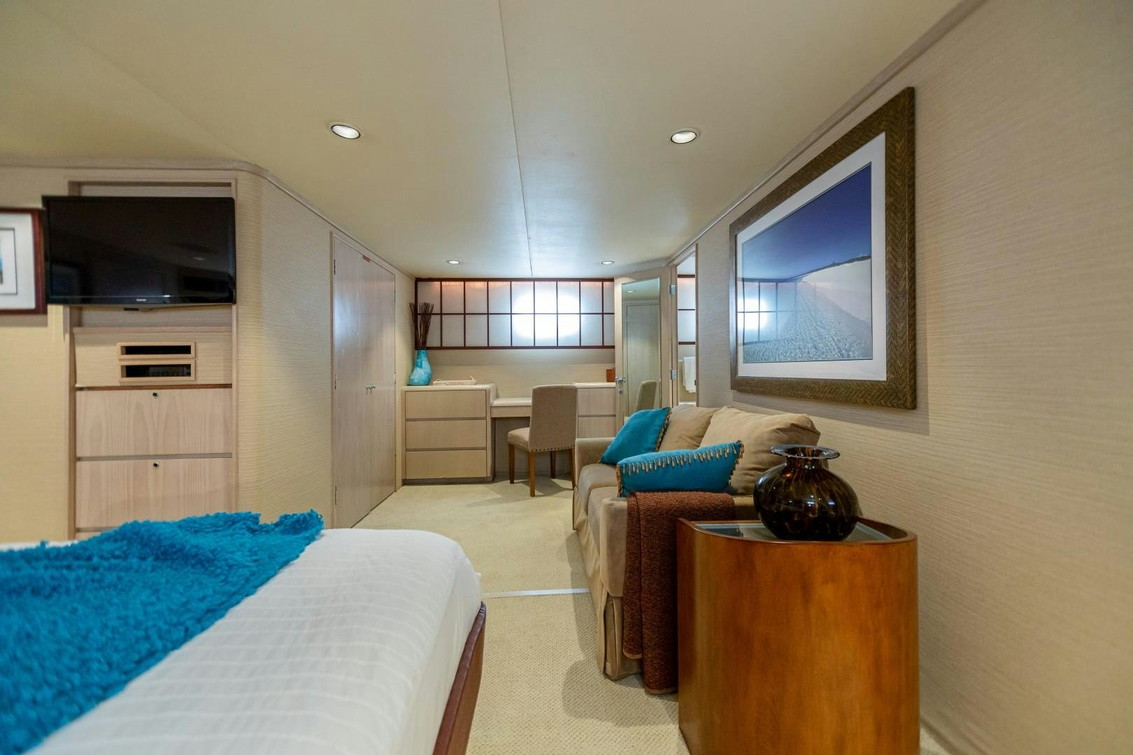 a living room with a bed and a table aboard ISLAND TIME Yacht for Sale
