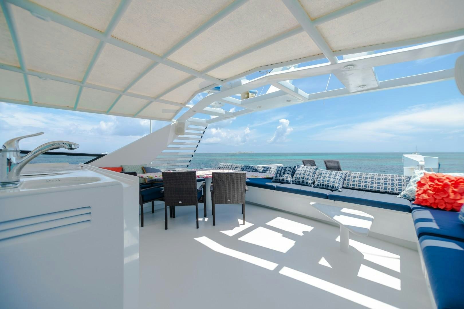 a room with chairs and tables aboard ISLAND TIME Yacht for Sale