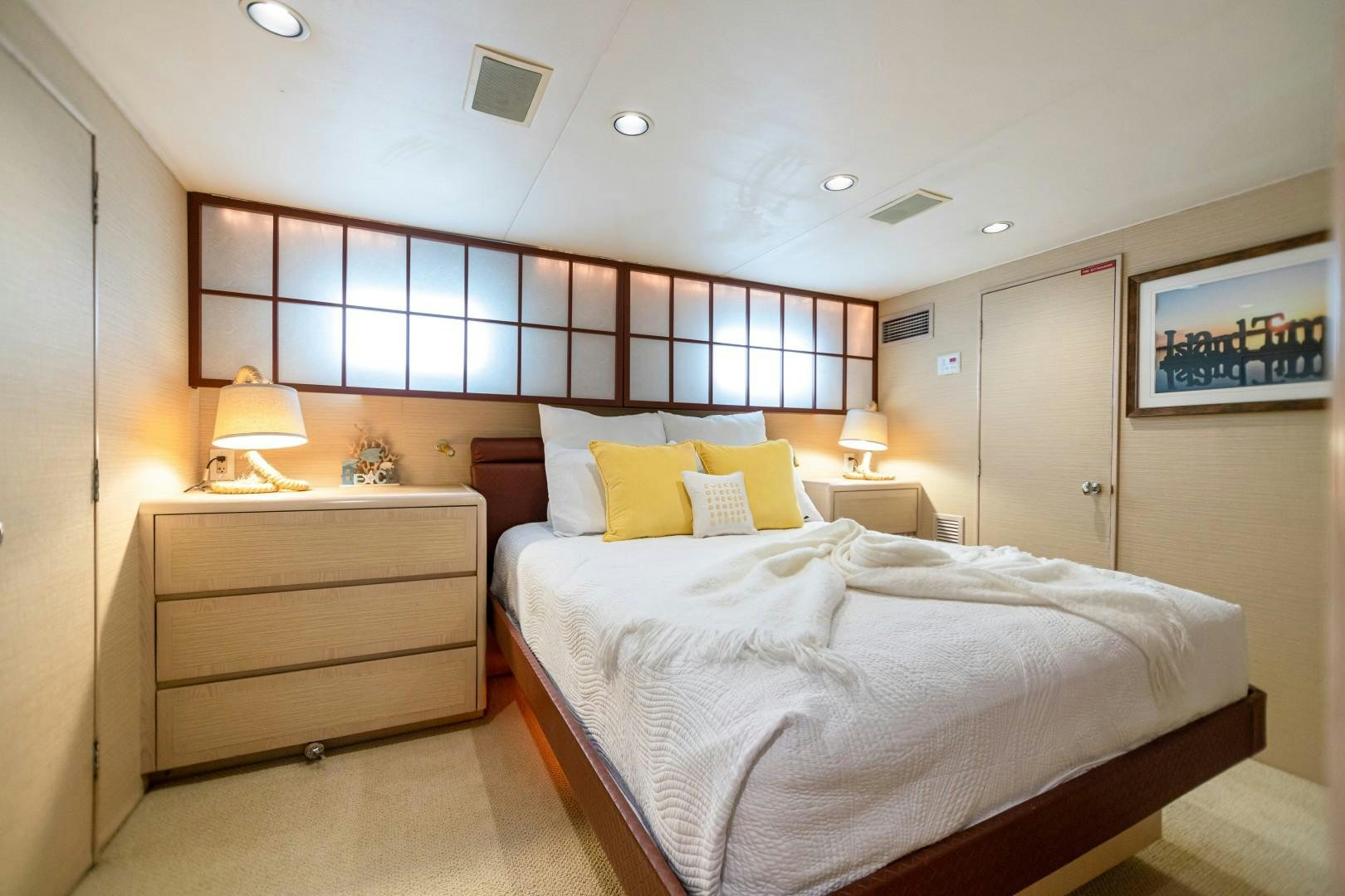 a bedroom with a large bed aboard ISLAND TIME Yacht for Sale