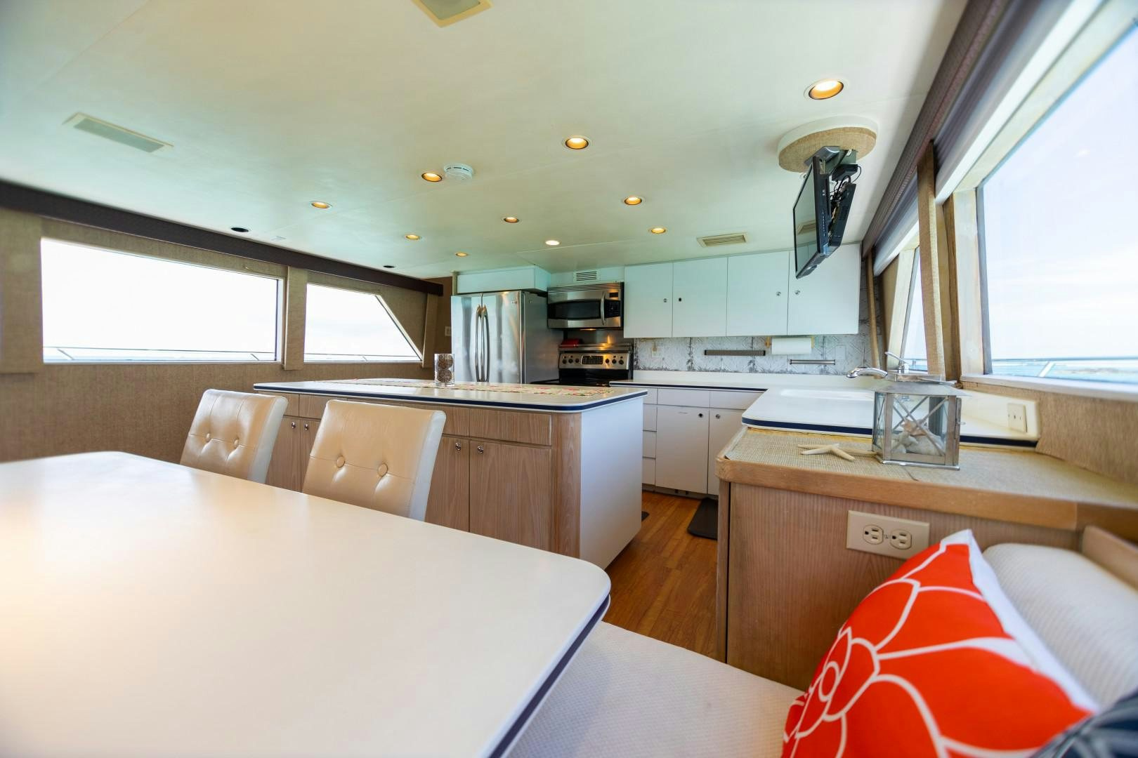 a kitchen with a table and chairs aboard ISLAND TIME Yacht for Sale