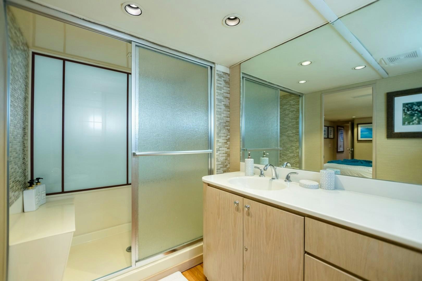 a bathroom with a large mirror aboard ISLAND TIME Yacht for Sale