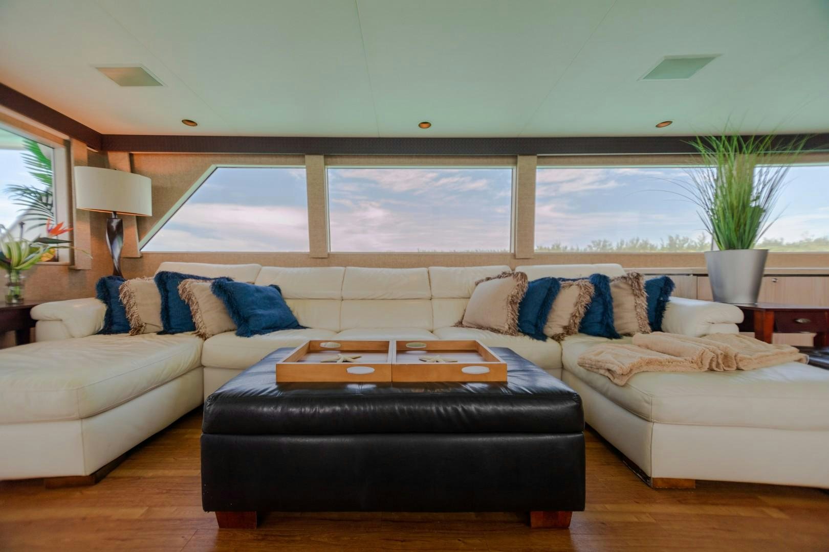a living room with a large window aboard ISLAND TIME Yacht for Sale