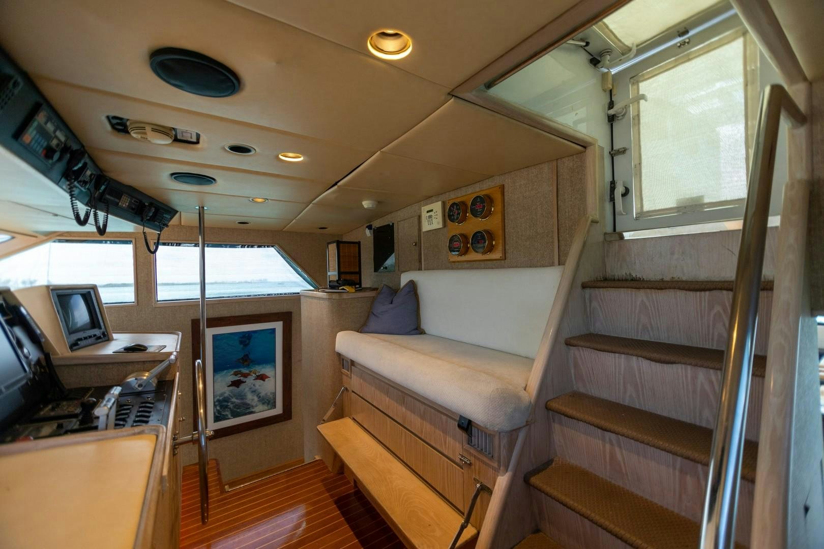 a room with a bed and a desk aboard ISLAND TIME Yacht for Sale