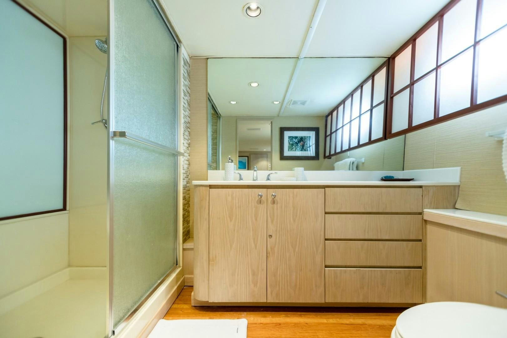 a bathroom with a glass door aboard ISLAND TIME Yacht for Sale