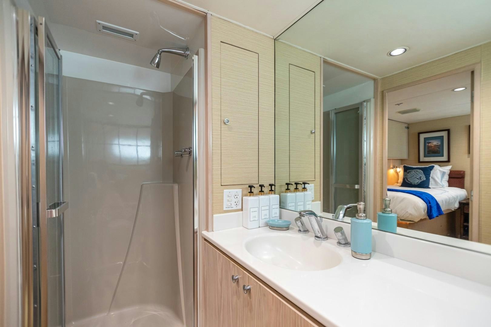 a bathroom with a large mirror aboard ISLAND TIME Yacht for Sale