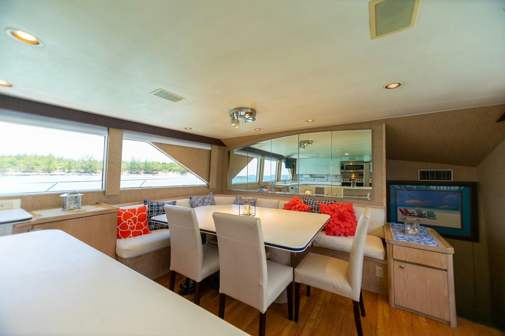a room with a table chairs and a tv aboard ISLAND TIME Yacht for Sale