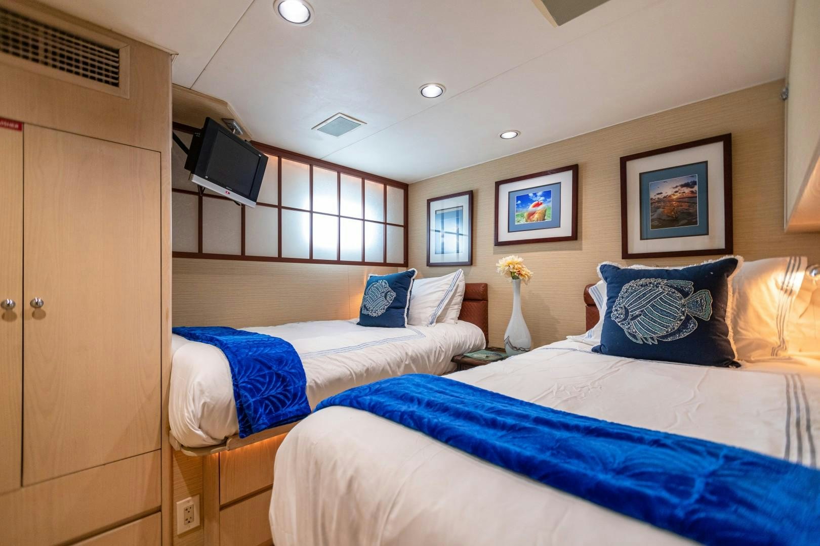 a couple of beds in a room aboard ISLAND TIME Yacht for Sale