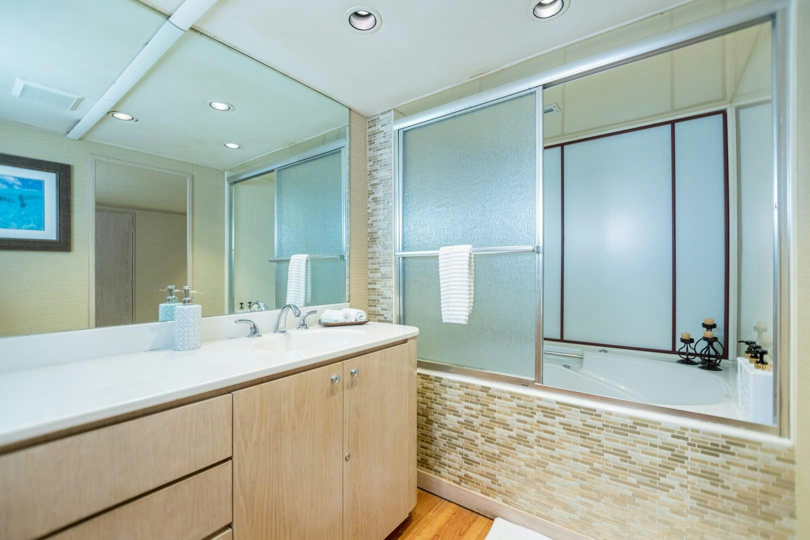 a bathroom with a large mirror aboard ISLAND TIME Yacht for Sale