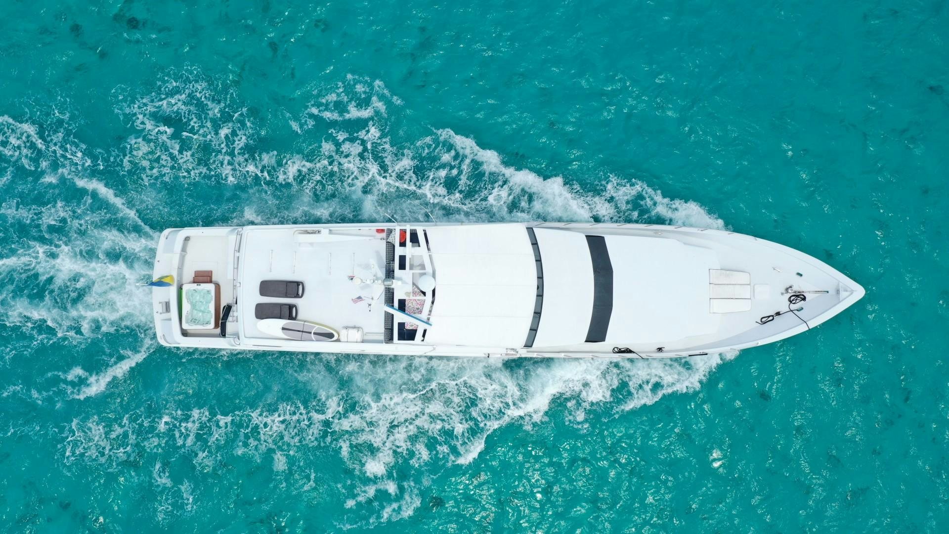 a white boat in the water aboard ISLAND TIME Yacht for Sale