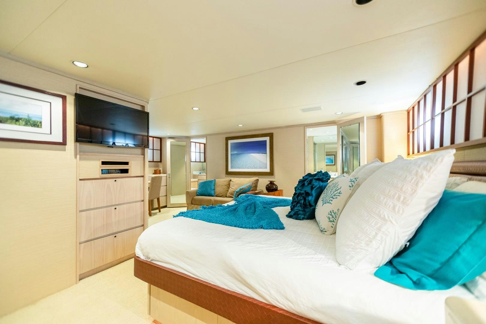 a bedroom with a large bed aboard ISLAND TIME Yacht for Sale