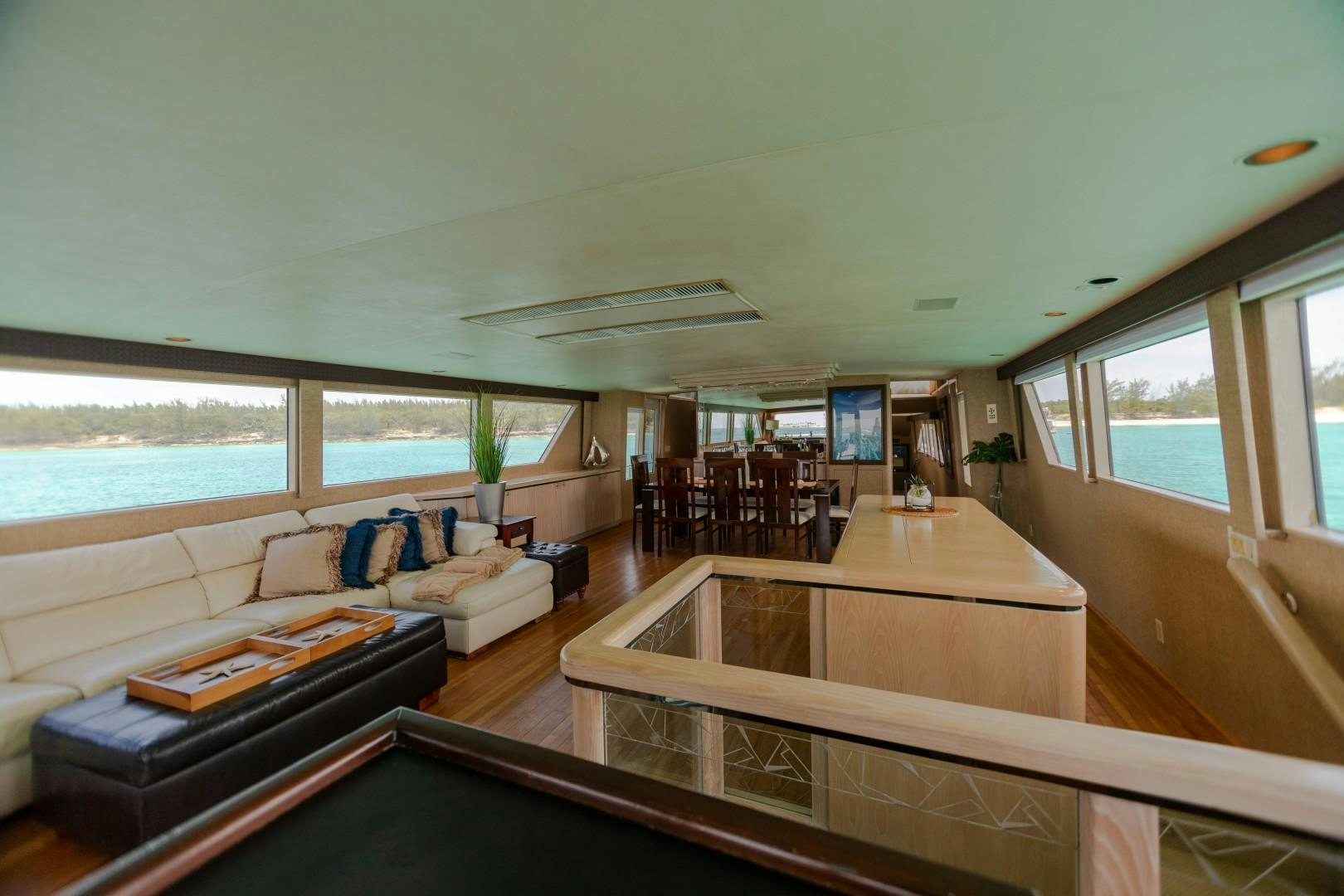 a living room with a large window aboard ISLAND TIME Yacht for Sale