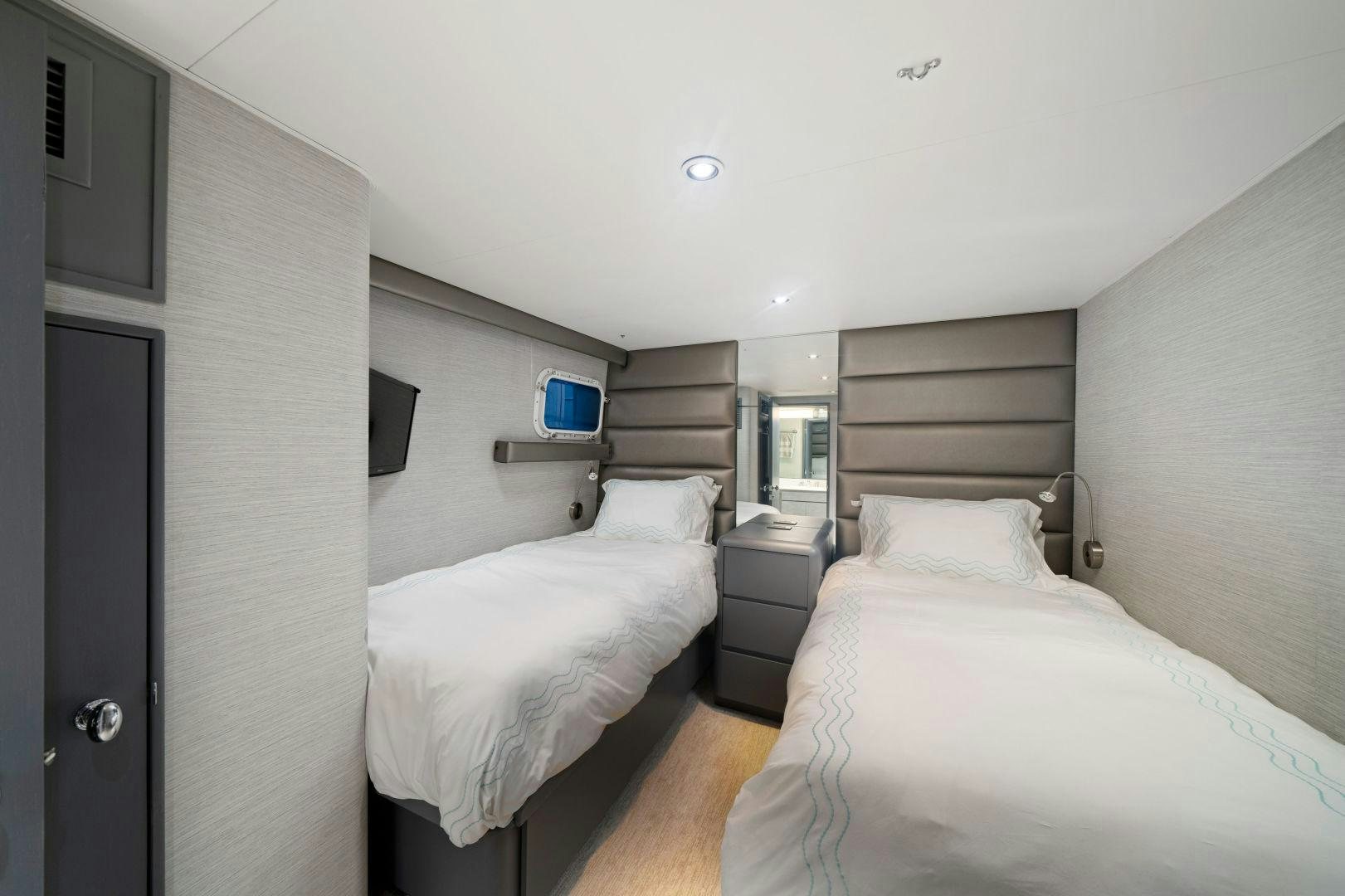 a room with two beds aboard EXIT STRATEGY Yacht for Sale