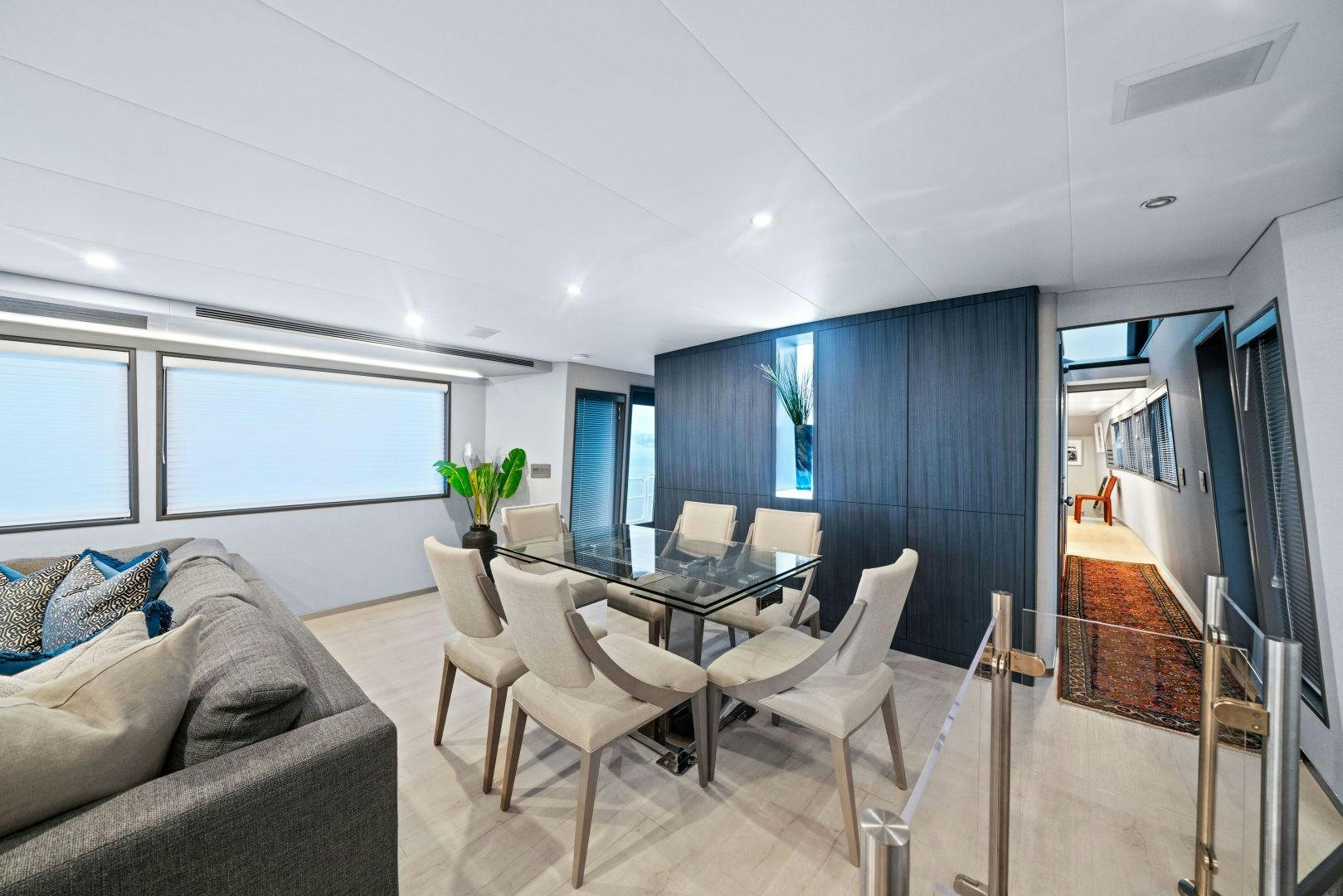 a living room with a couch and a table aboard EXIT STRATEGY Yacht for Sale