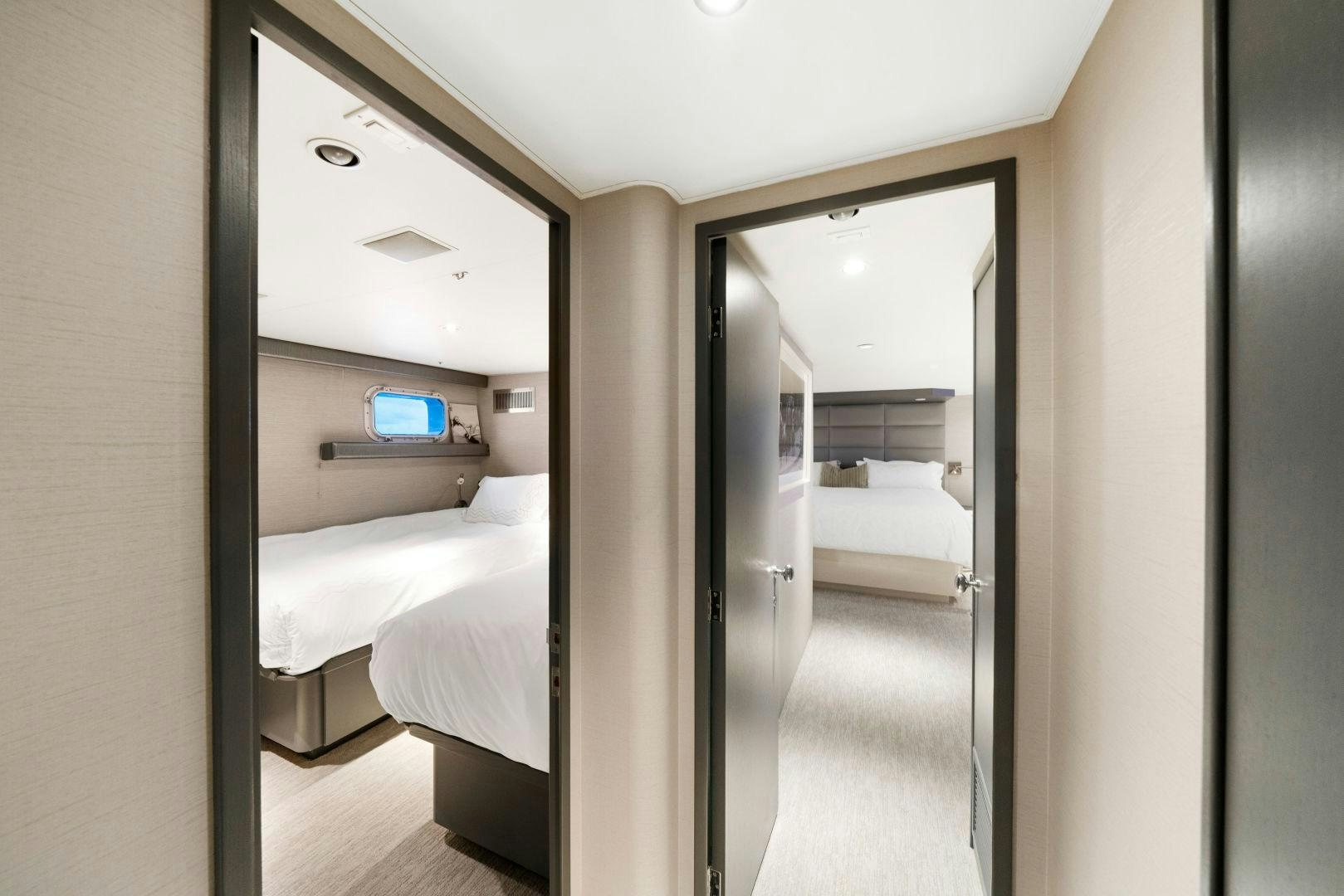 a room with a bed and a computer on the wall aboard EXIT STRATEGY Yacht for Sale