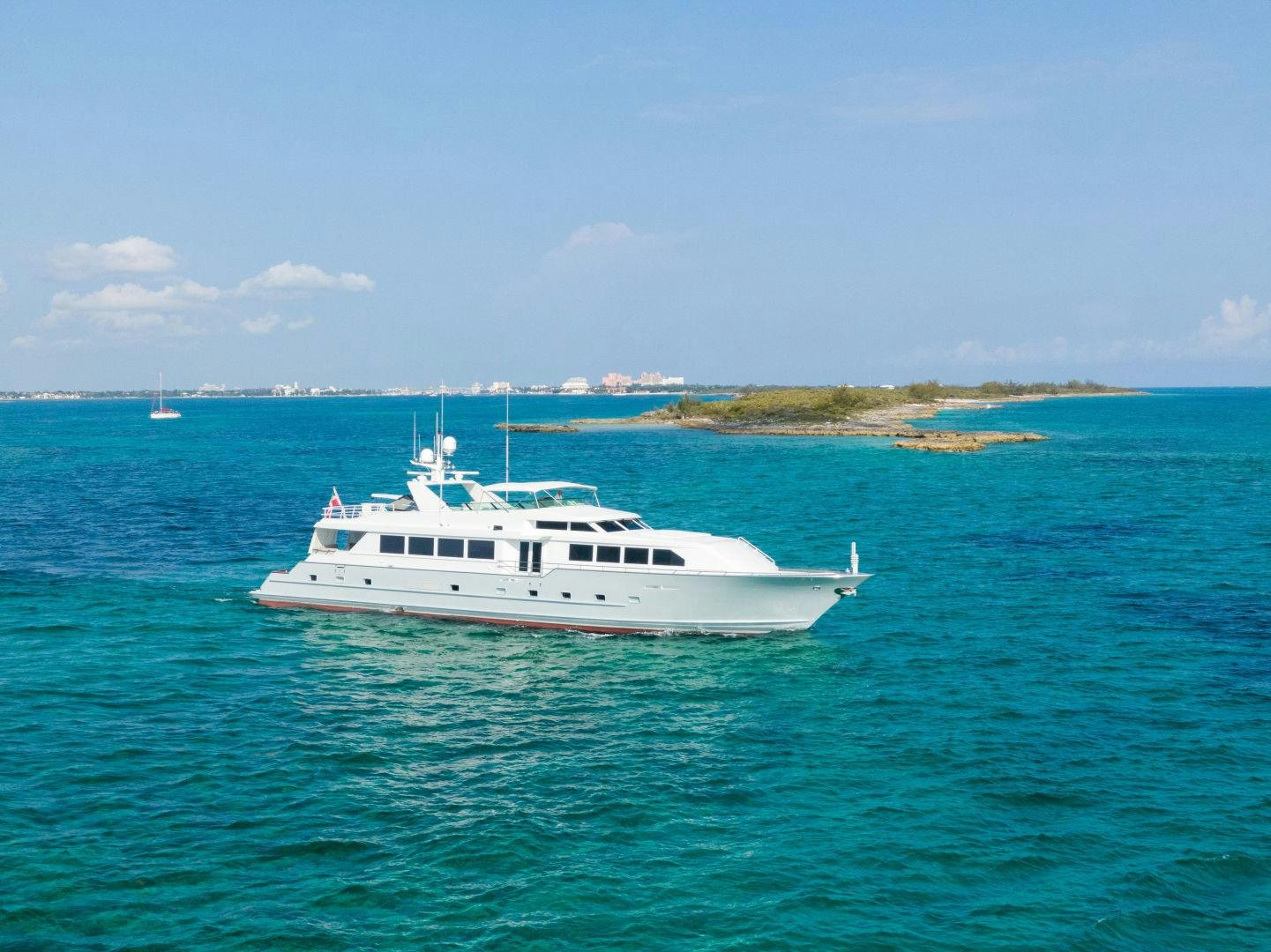 a white yacht in the water aboard EXIT STRATEGY Yacht for Sale