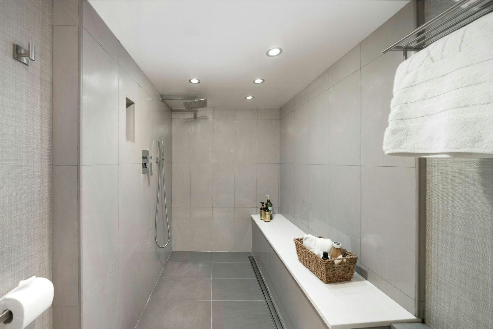 a bathroom with a countertop sink and a shower aboard EXIT STRATEGY Yacht for Sale