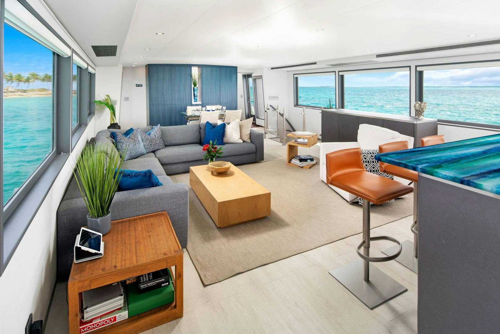 a living room with a couch and a table aboard EXIT STRATEGY Yacht for Sale