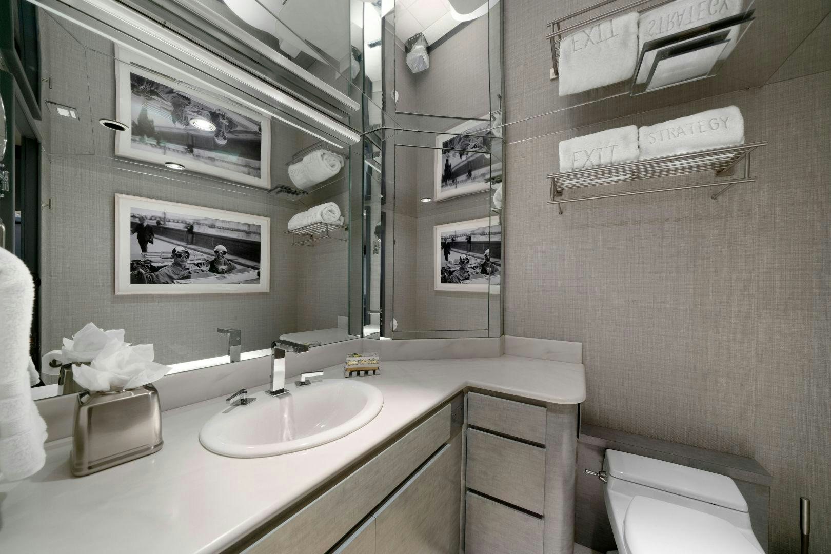 a bathroom with a sink and a mirror aboard EXIT STRATEGY Yacht for Sale
