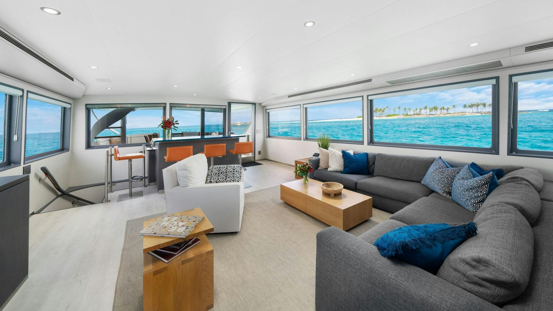 a living room with a couch and a table aboard EXIT STRATEGY Yacht for Sale