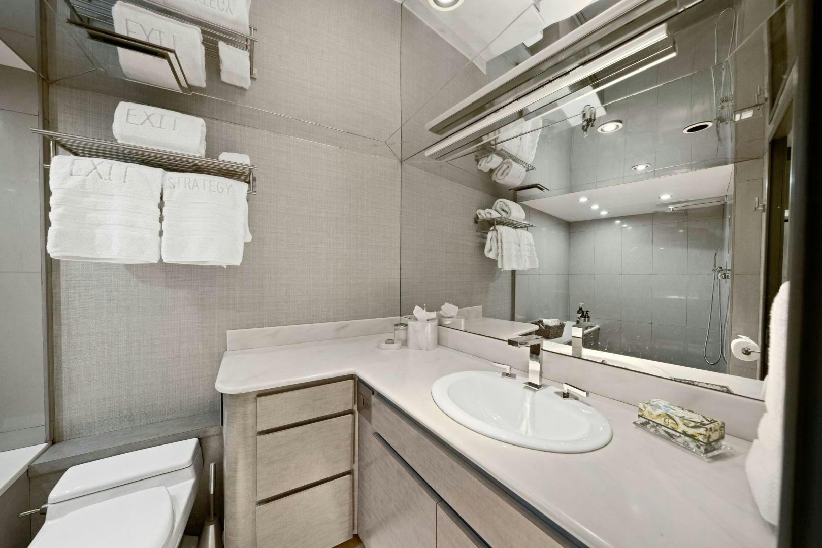 a bathroom with a large mirror aboard EXIT STRATEGY Yacht for Sale