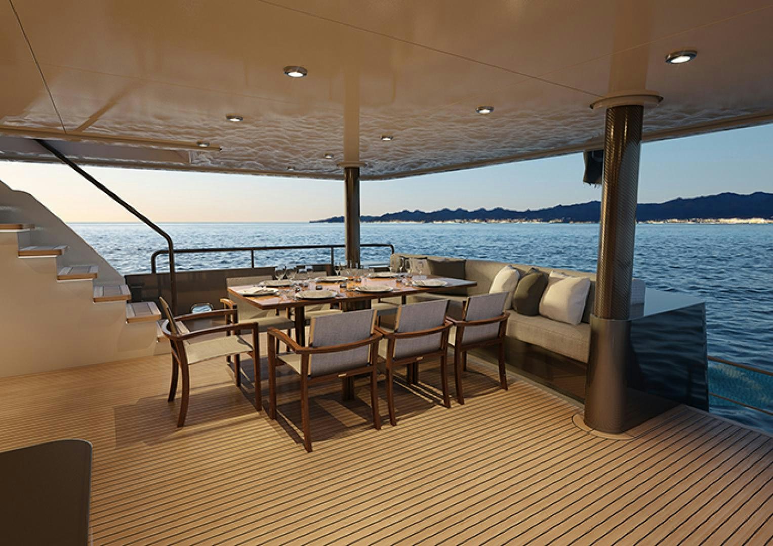 a table and chairs on a deck aboard CRESCENT 110 Yacht for Sale