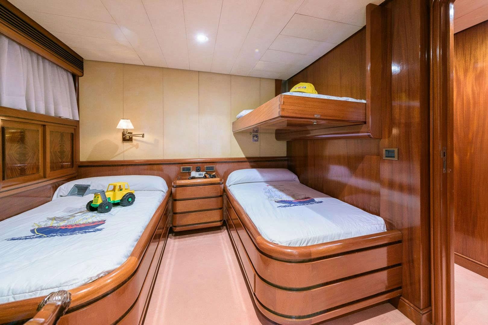a room with a bed and a table aboard ELBA Yacht for Sale