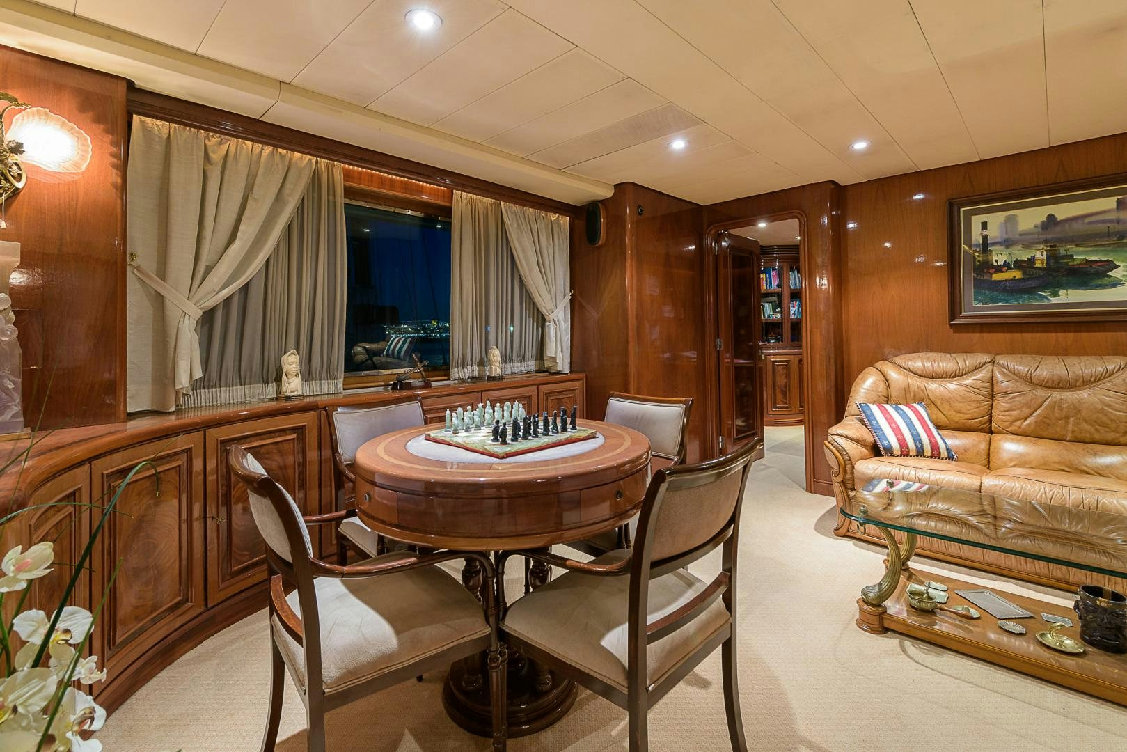 a living room with a couch and a table aboard ELBA Yacht for Sale