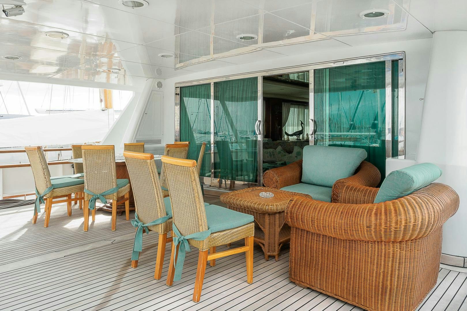 a room with chairs and tables aboard ELBA Yacht for Sale