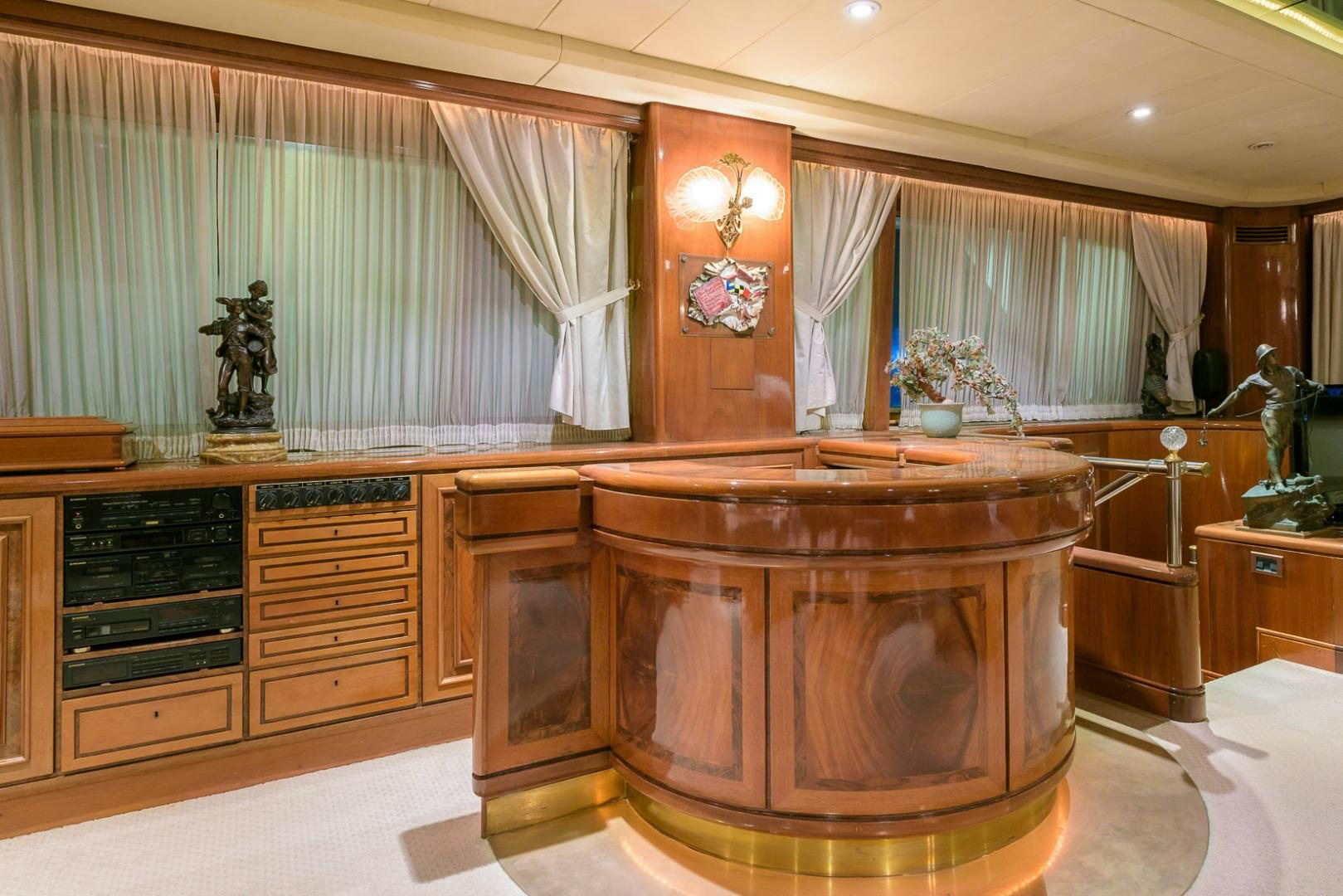a large wooden cabinet in a room aboard ELBA Yacht for Sale