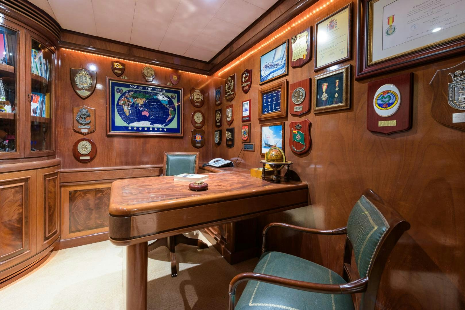 a room with a table and chairs aboard ELBA Yacht for Sale