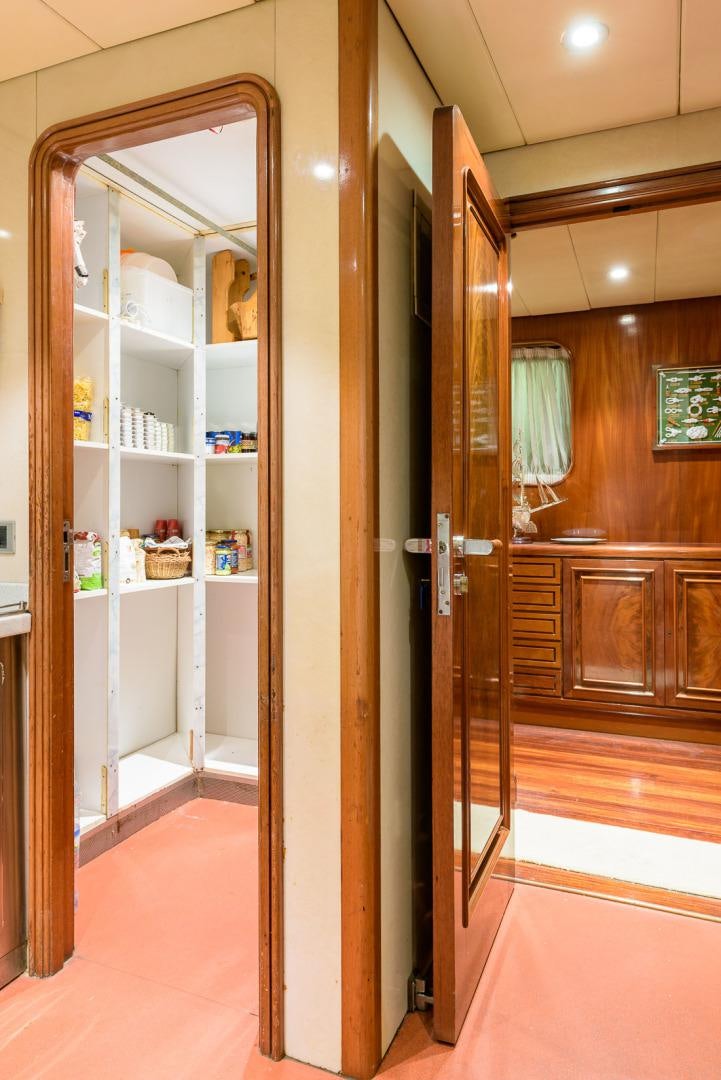 a large wooden closet aboard ELBA Yacht for Sale