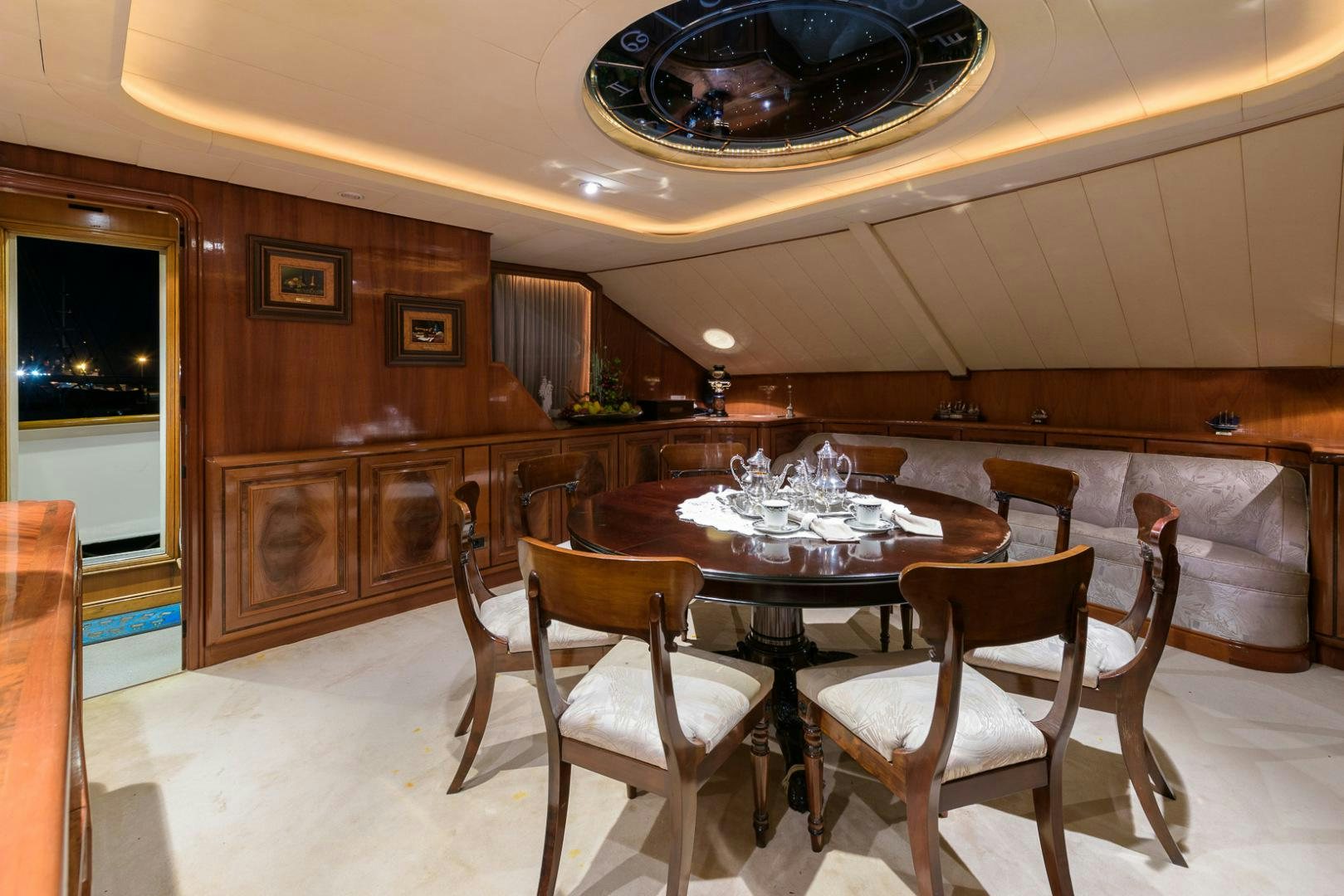 a dining room with a table and chairs aboard ELBA Yacht for Sale