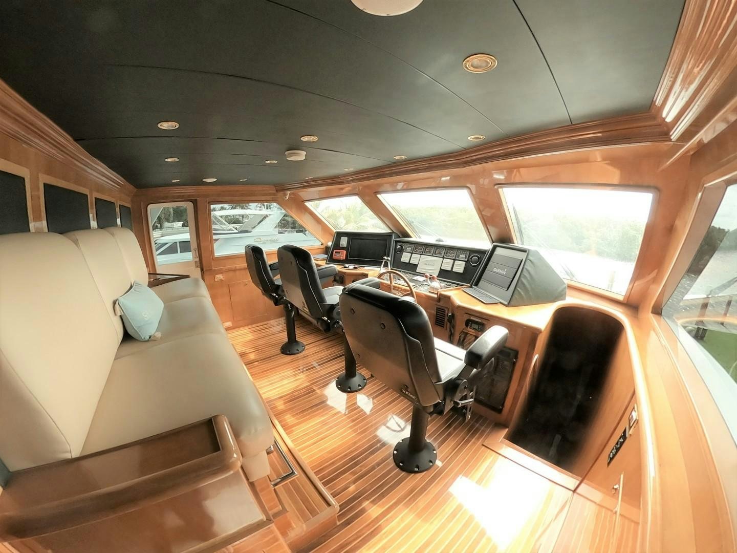 a room with a couch and a desk with a computer on it aboard SEAS THE DAY Yacht for Sale