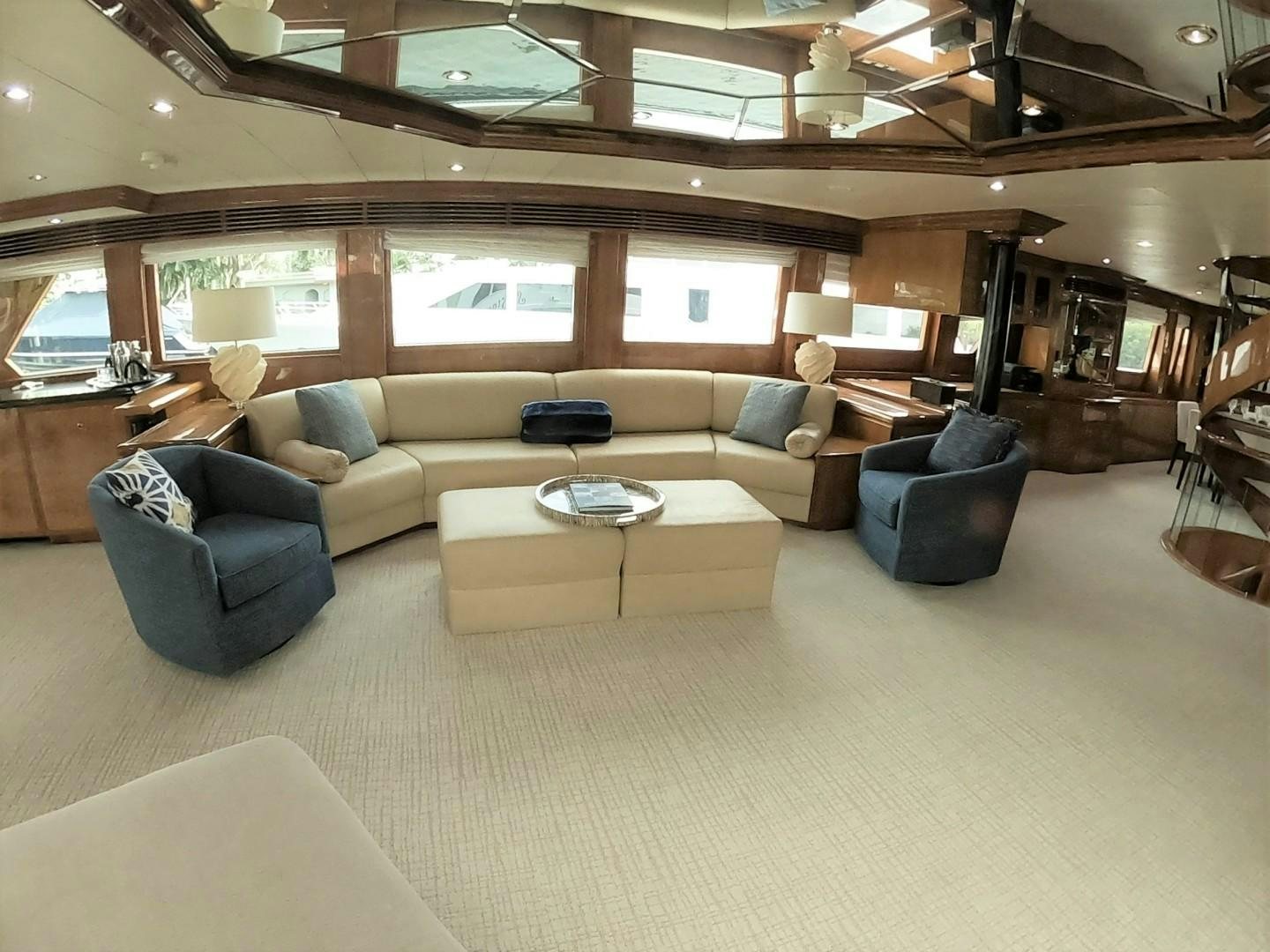 a room with a couch and a table aboard SEAS THE DAY Yacht for Sale