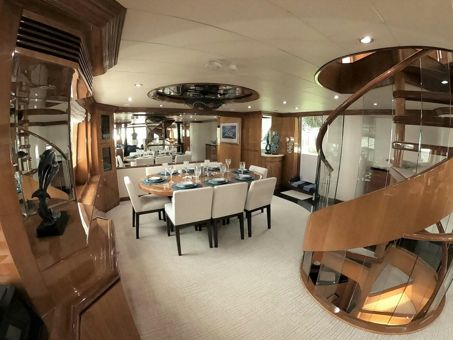 a room with a table and chairs aboard SEAS THE DAY Yacht for Sale