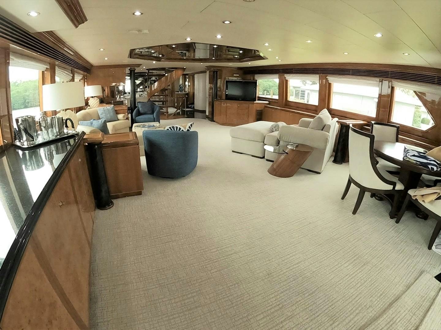 a living room with a couch and a table aboard SEAS THE DAY Yacht for Sale
