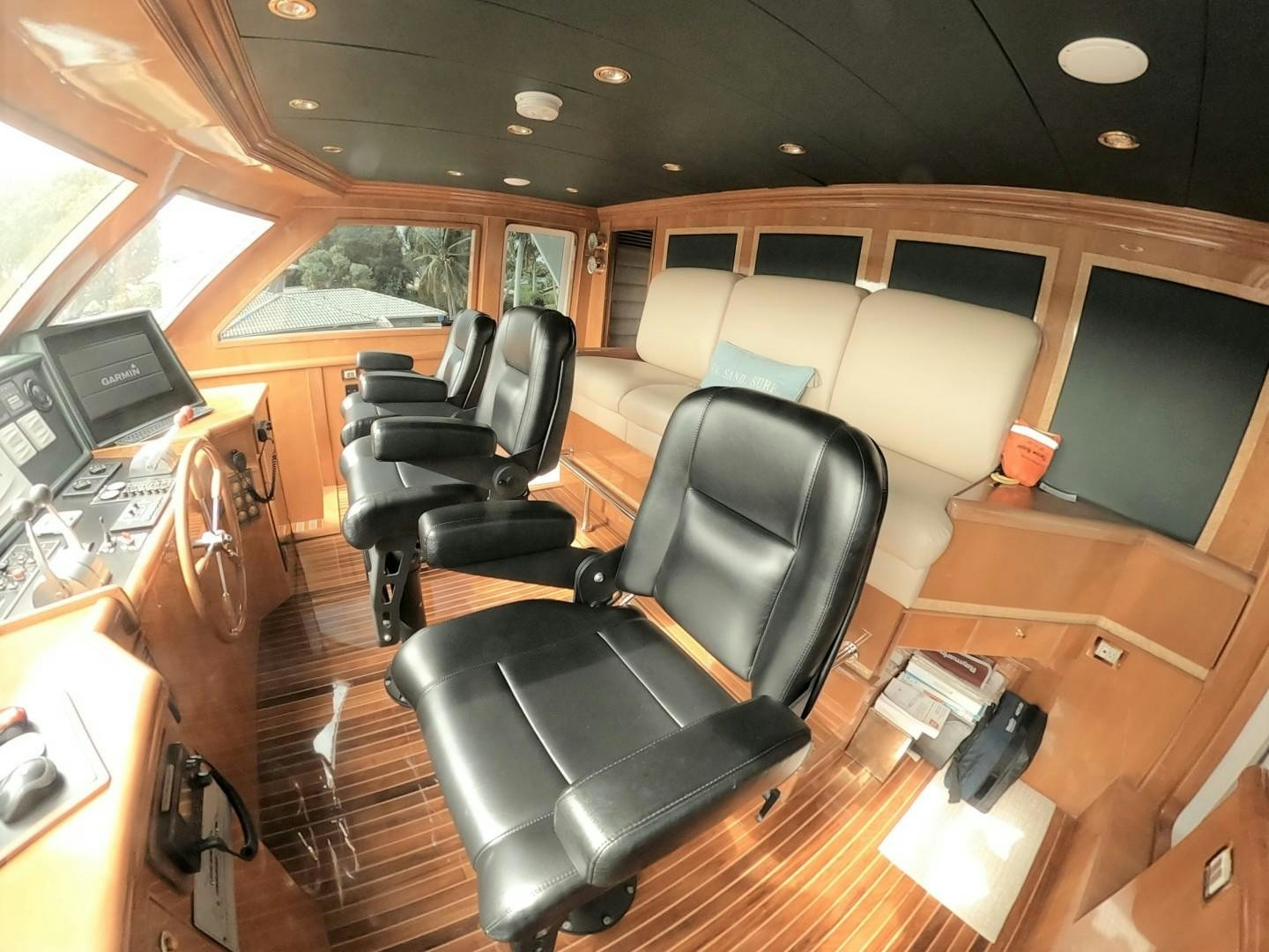 a room with a leather chair and a desk with a computer aboard SEAS THE DAY Yacht for Sale