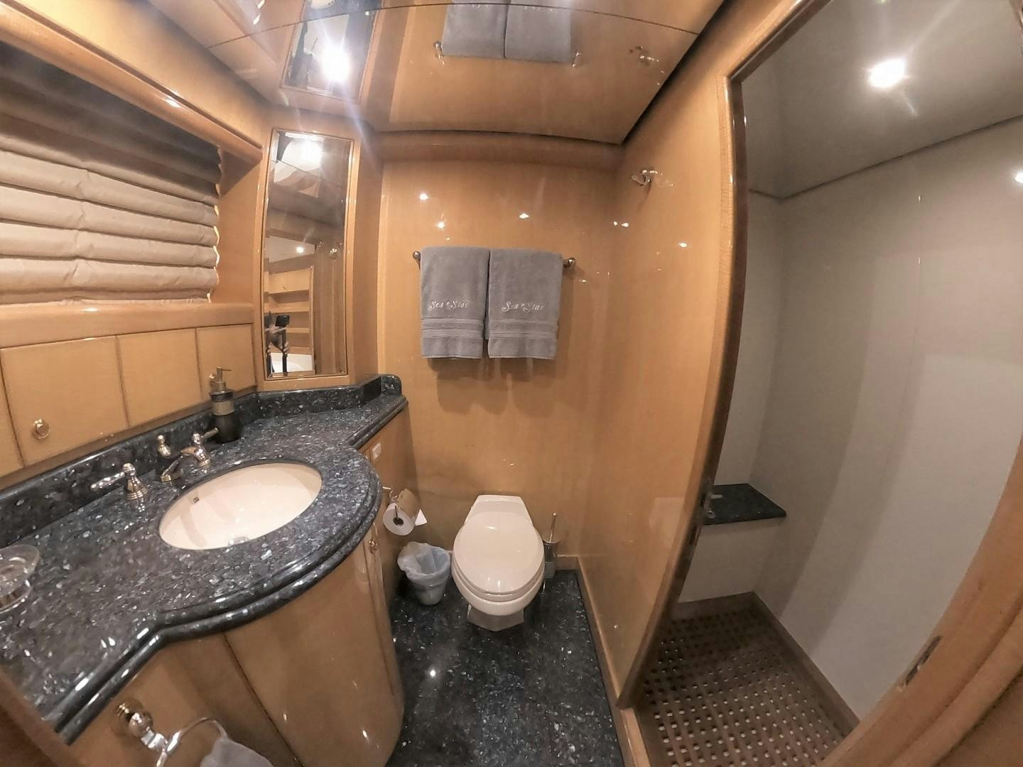 a bathroom with a sink and toilet aboard SEAS THE DAY Yacht for Sale