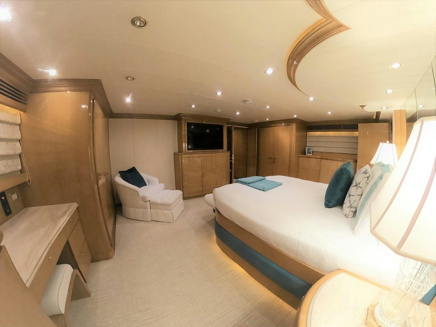 a room with a bed and a wood door aboard SEAS THE DAY Yacht for Sale