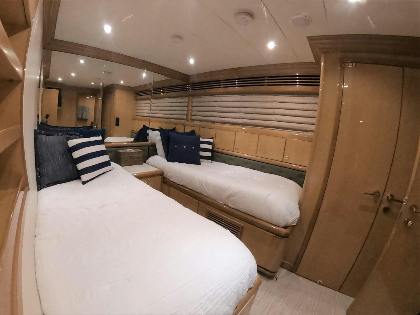 a room with a bed and a wood door aboard SEAS THE DAY Yacht for Sale