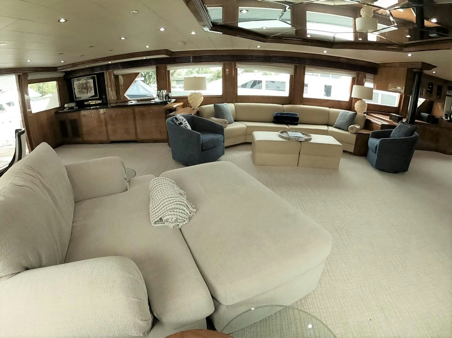 a living room with a couch and a television aboard SEAS THE DAY Yacht for Sale