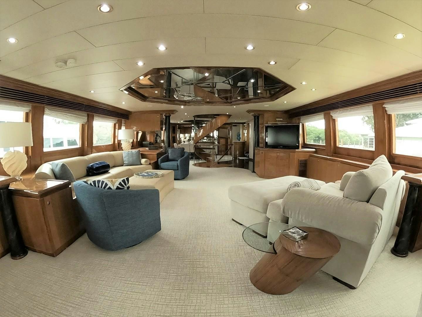 a living room with a large fireplace aboard SEAS THE DAY Yacht for Sale