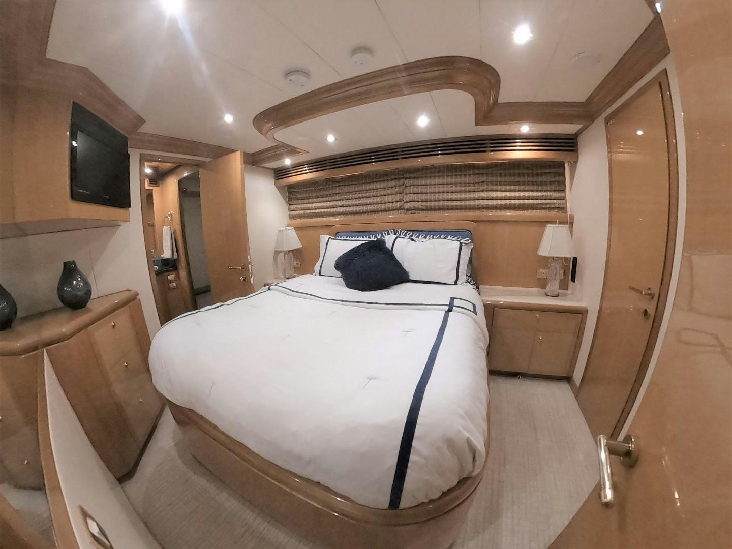a bedroom with a bed and a sink aboard SEAS THE DAY Yacht for Sale